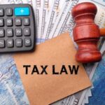calculatorbanknotesgavel brown card with text tax law wooden background 406607 2285 1